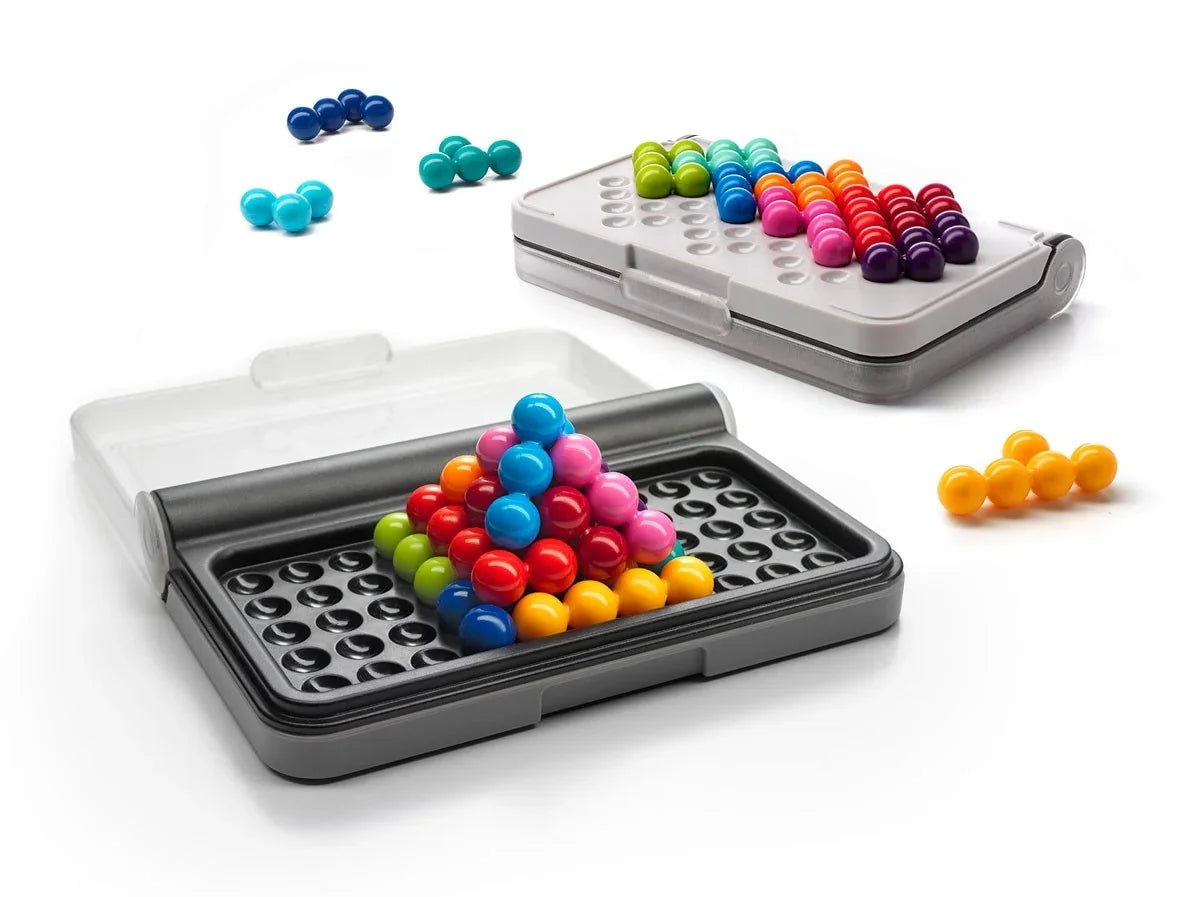 Smart Games IQ Puzzler Pro puzzle game featuring colorful, interlocking pieces on a white background.